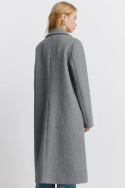 Abrigo largo bolsillos diagonales