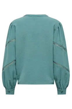 Blusa manga larga bordada