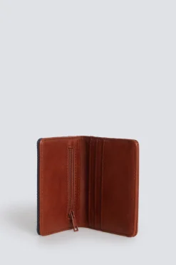 Cartera canvas y efecto piel