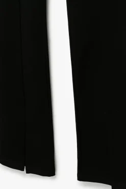 Leggings con abertura en la pierna y botones en la parte delantera