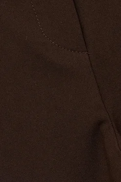 Pantal&oacute;n de tela con cintur&oacute;n