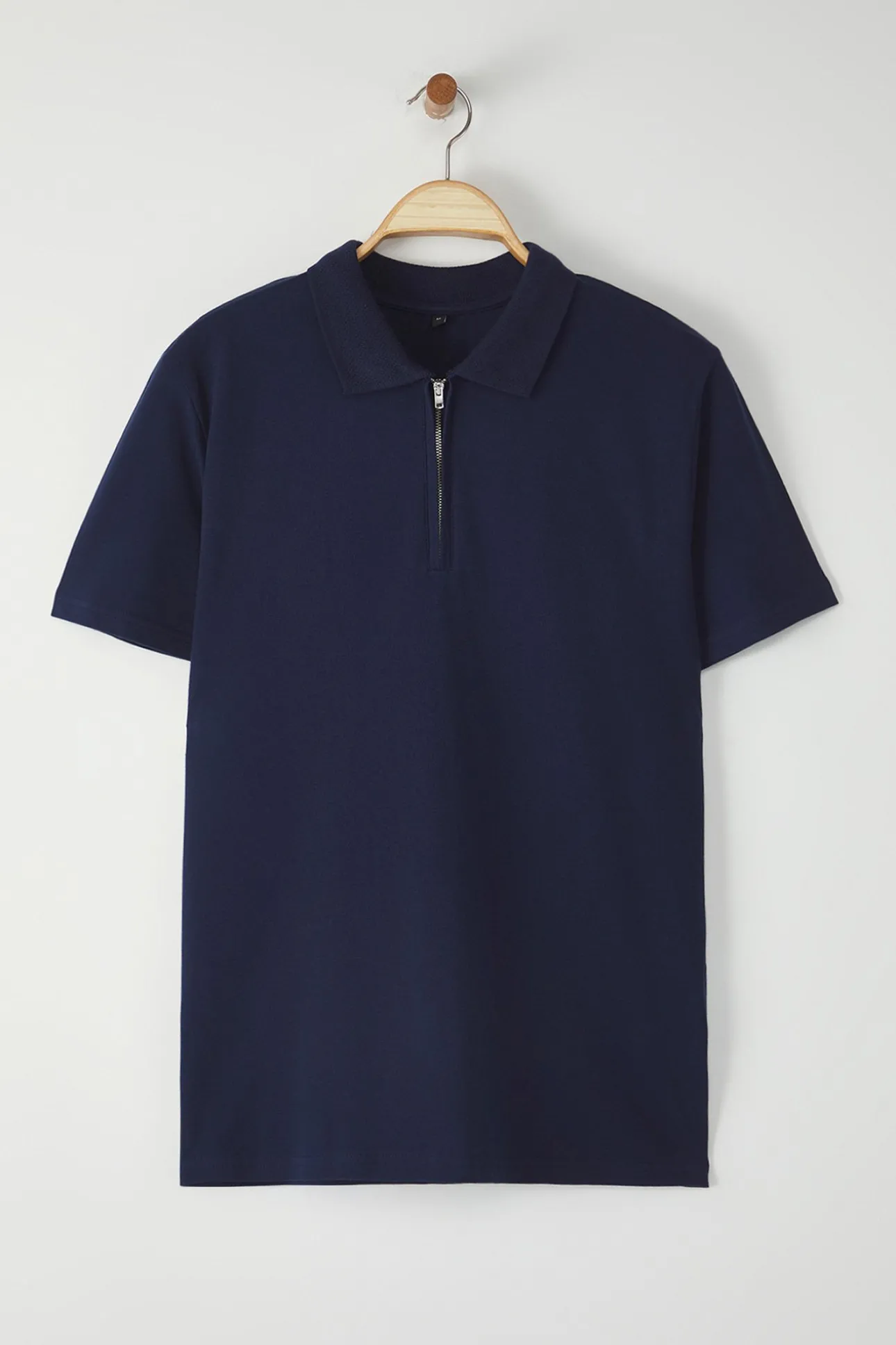 Polo de manga corta y cremallera