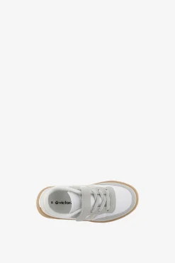 Zapatillas deportivas de ni&ntilde;os con piezas en contraste y cord&oacute;n el&aacute;stico